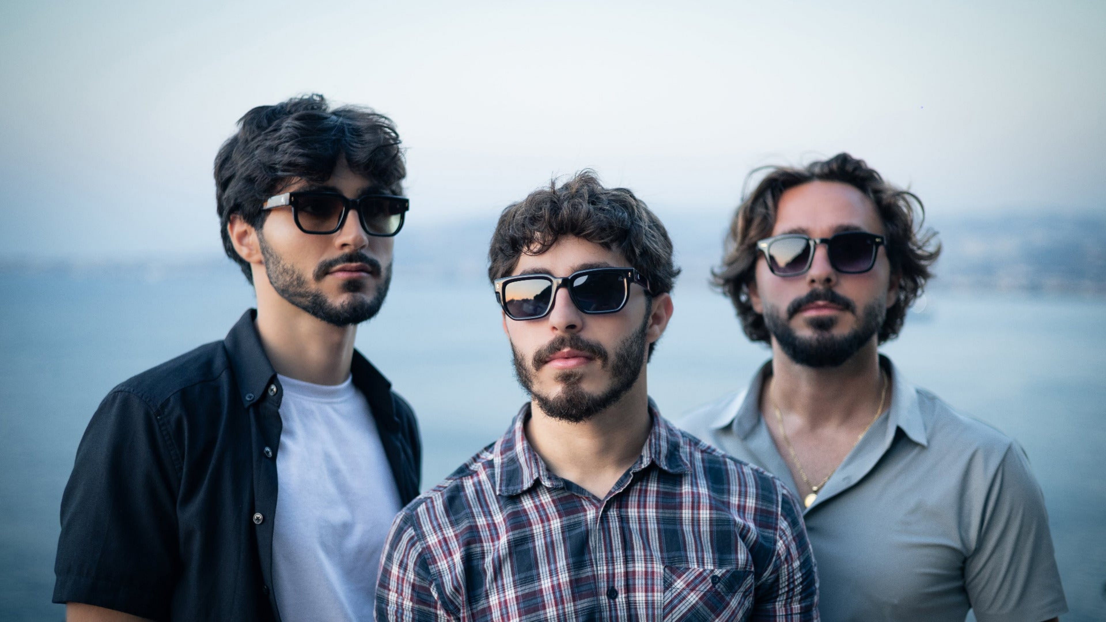 Three men wearing sunglasses